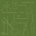 Chemical equipment, flasks and retorts, chemical formulas drawn in chalk on a school board